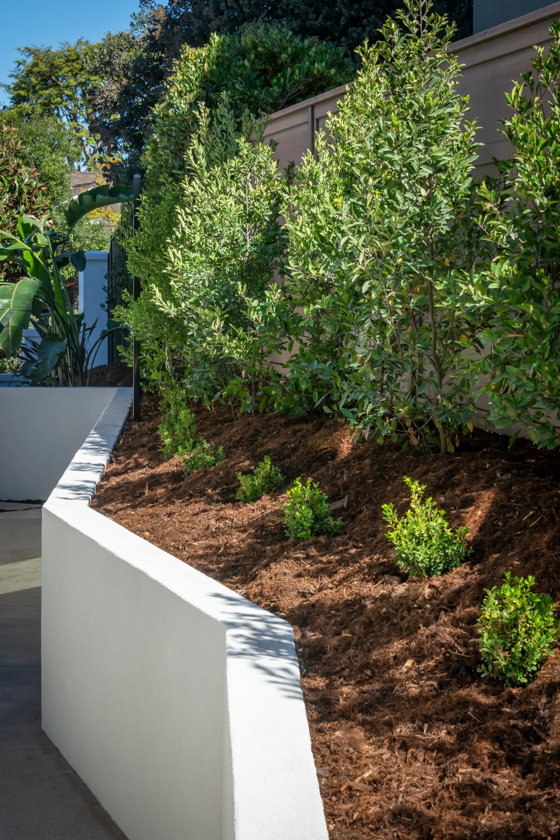 Professionally built retaining wall in a landscaped yard