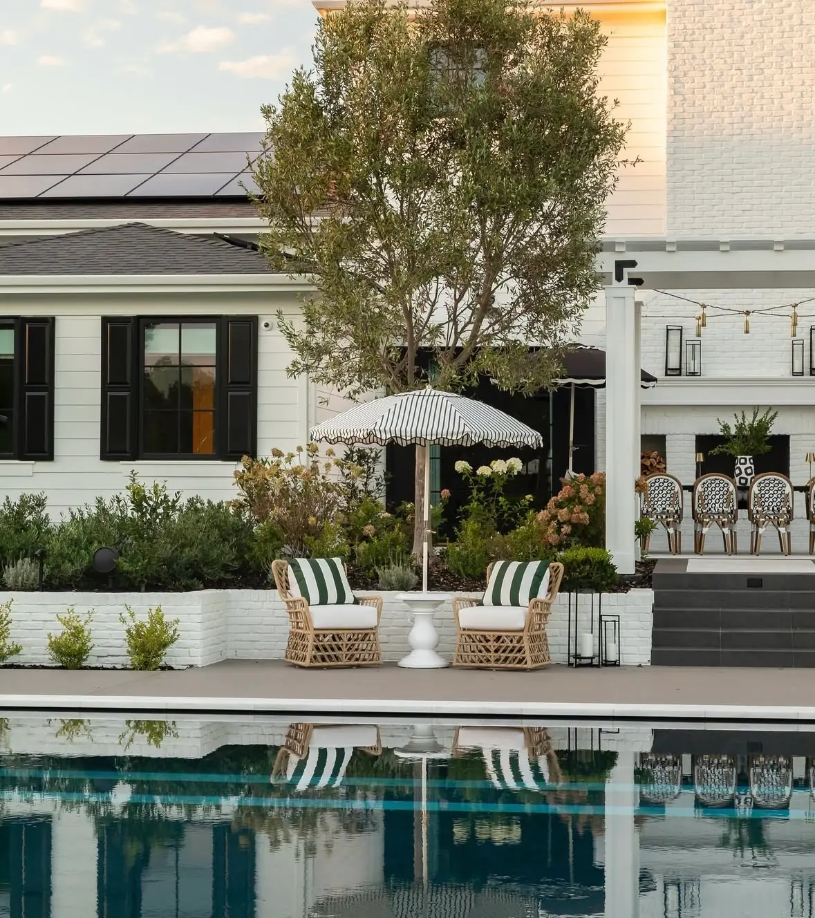 Luxury backyard patio at sunset with warm lighting
