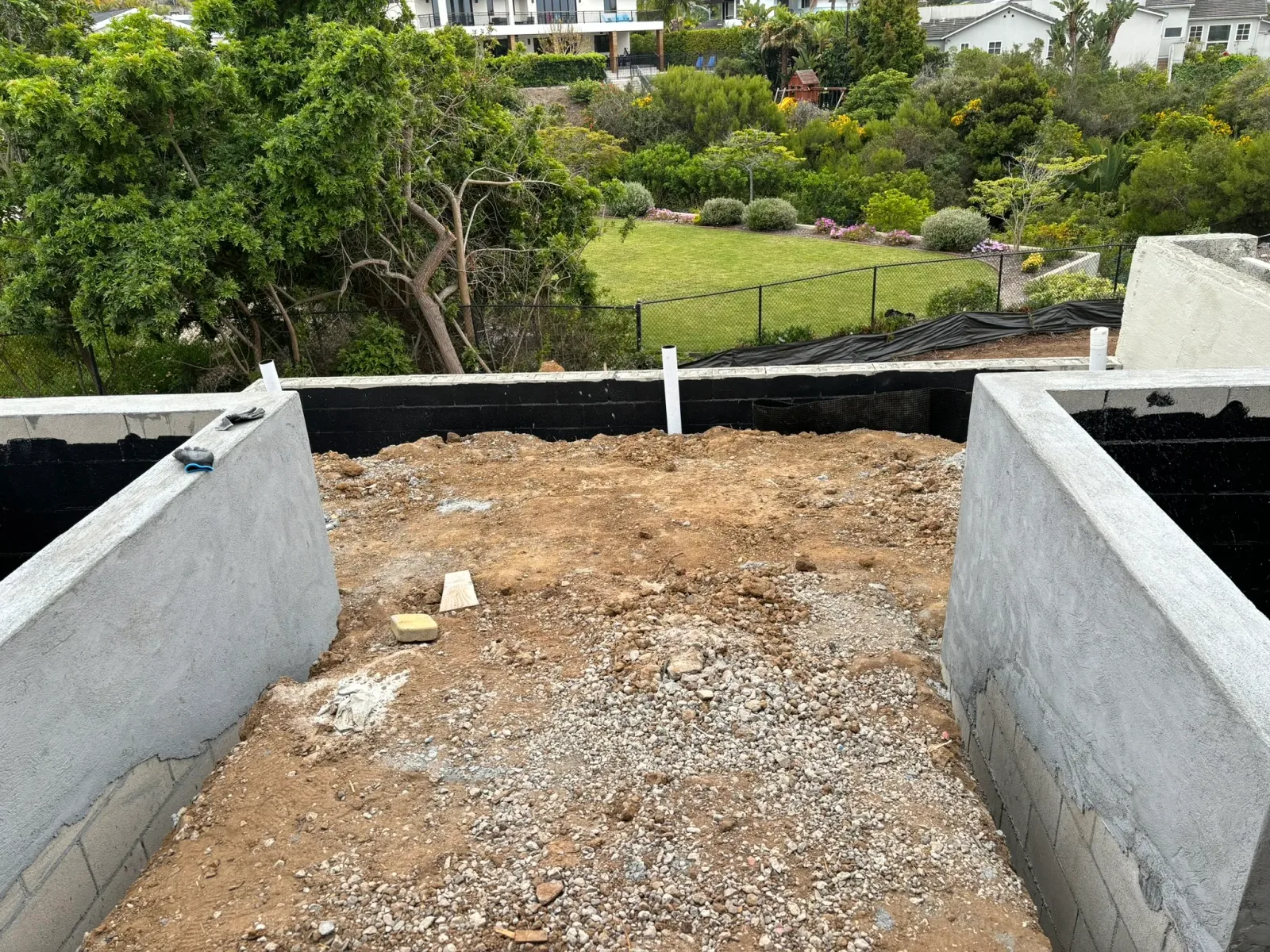 Custom fire pit integrated into paver patio with seating