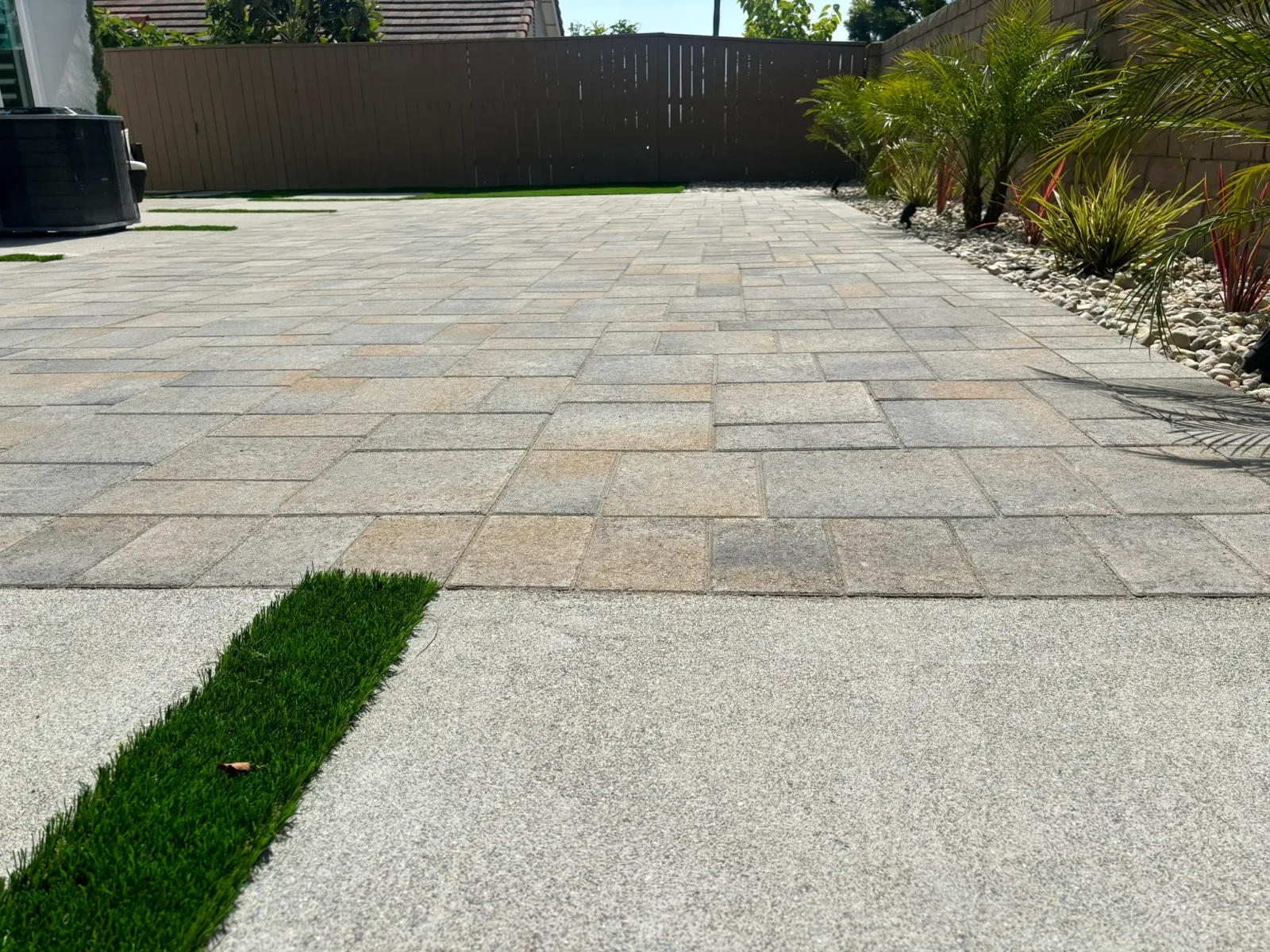 Retaining wall construction with proper base prep and drainage