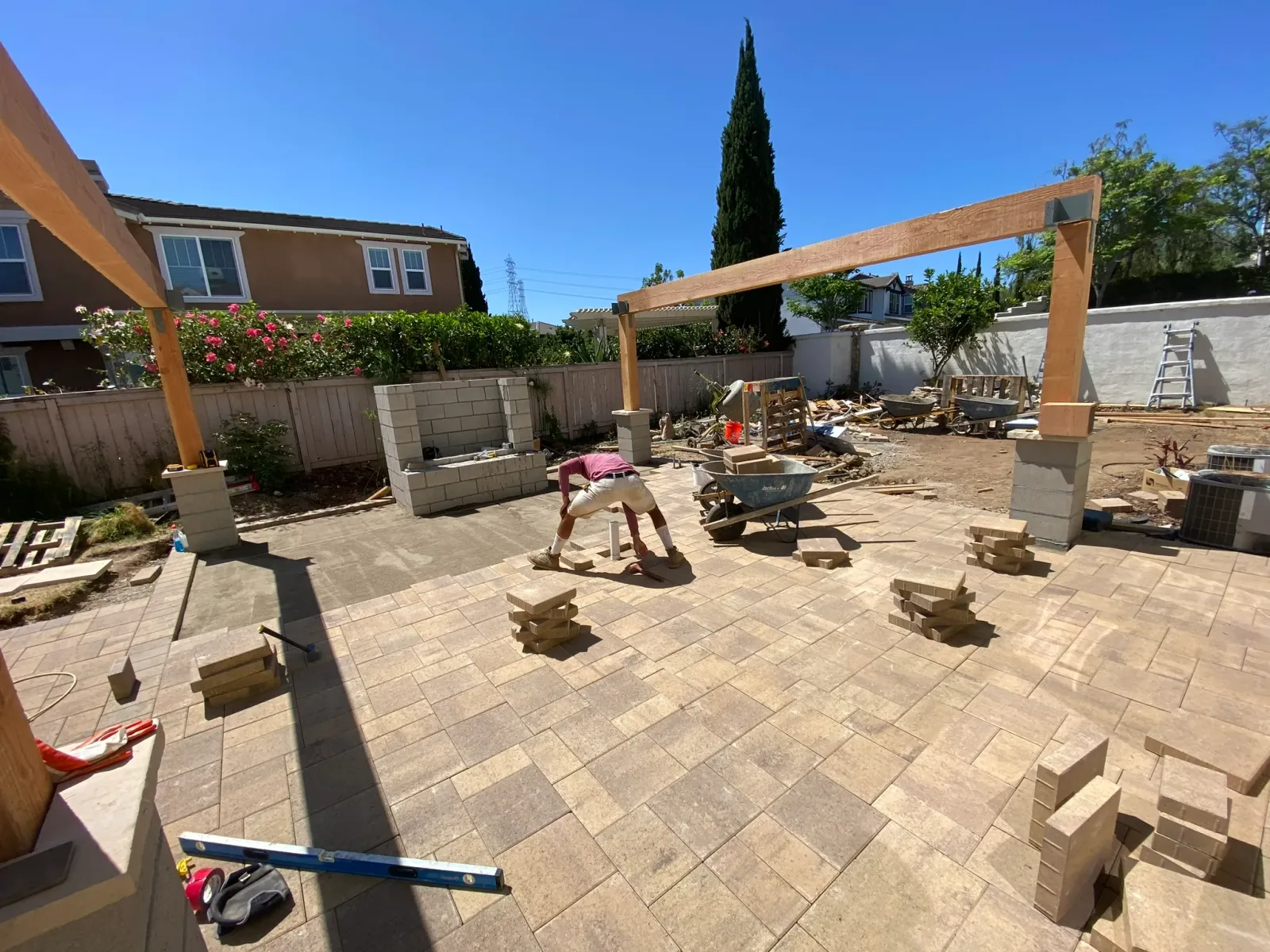 Outdoor kitchen integrated seamlessly into a complete backyard design