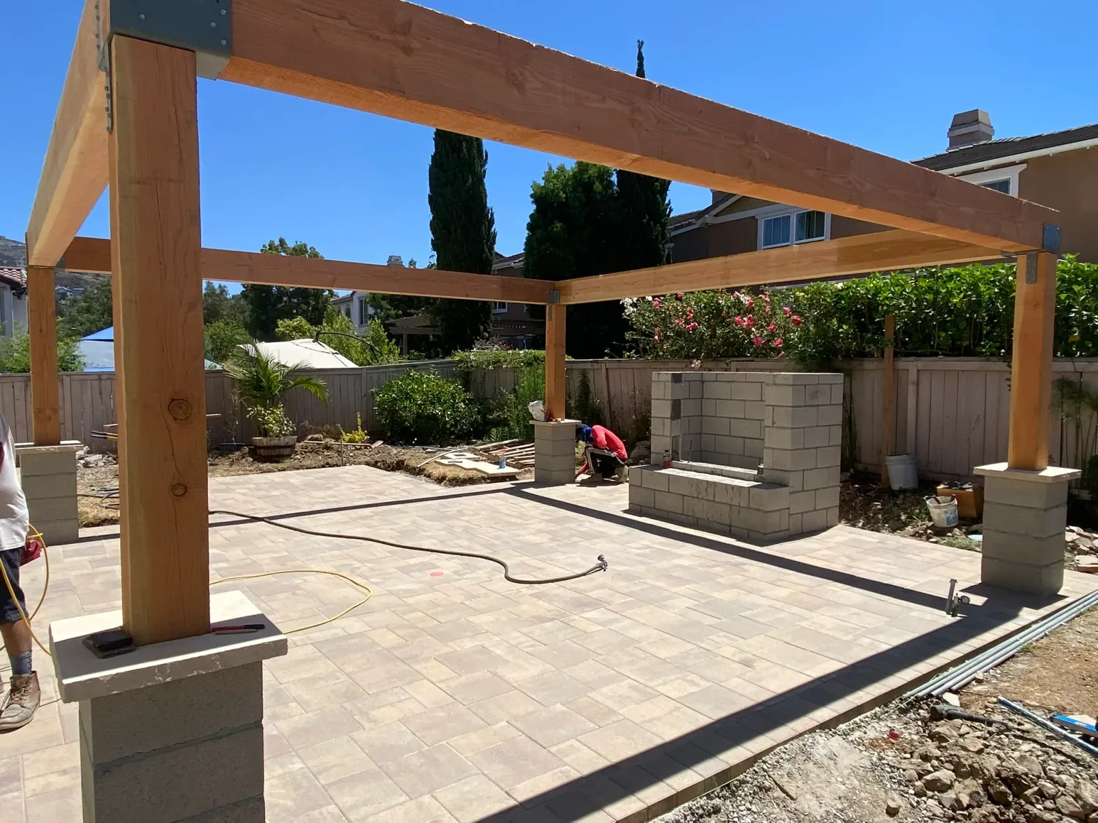 Backyard designed for entertaining with outdoor kitchen and dining area