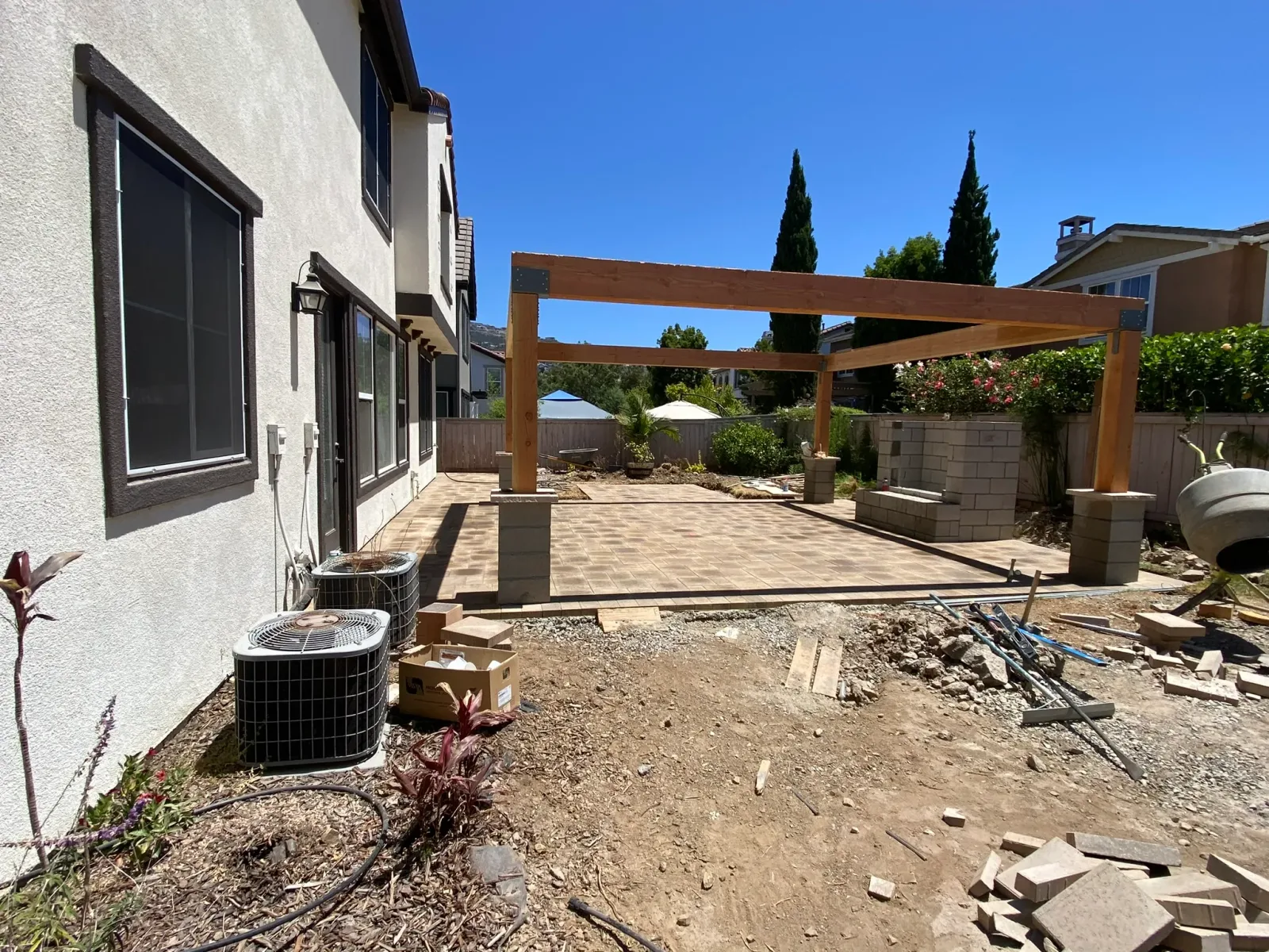 Shaded outdoor living area under a custom patio cover