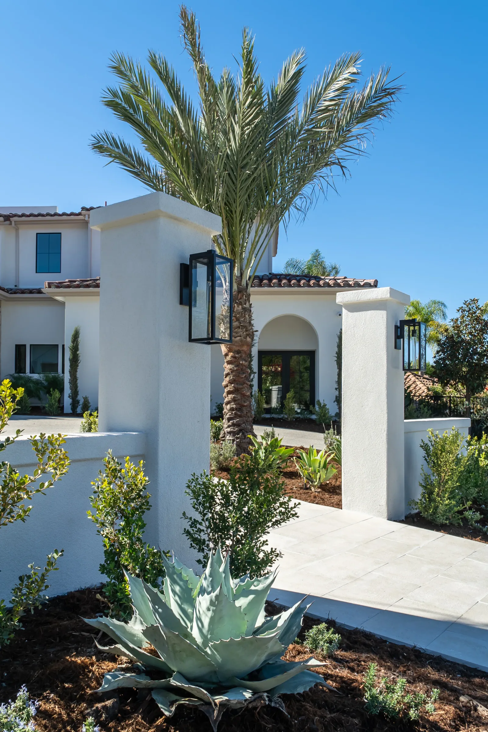 Complete coastal-modern backyard remodel in Encinitas with patio, walls, and outdoor kitchen